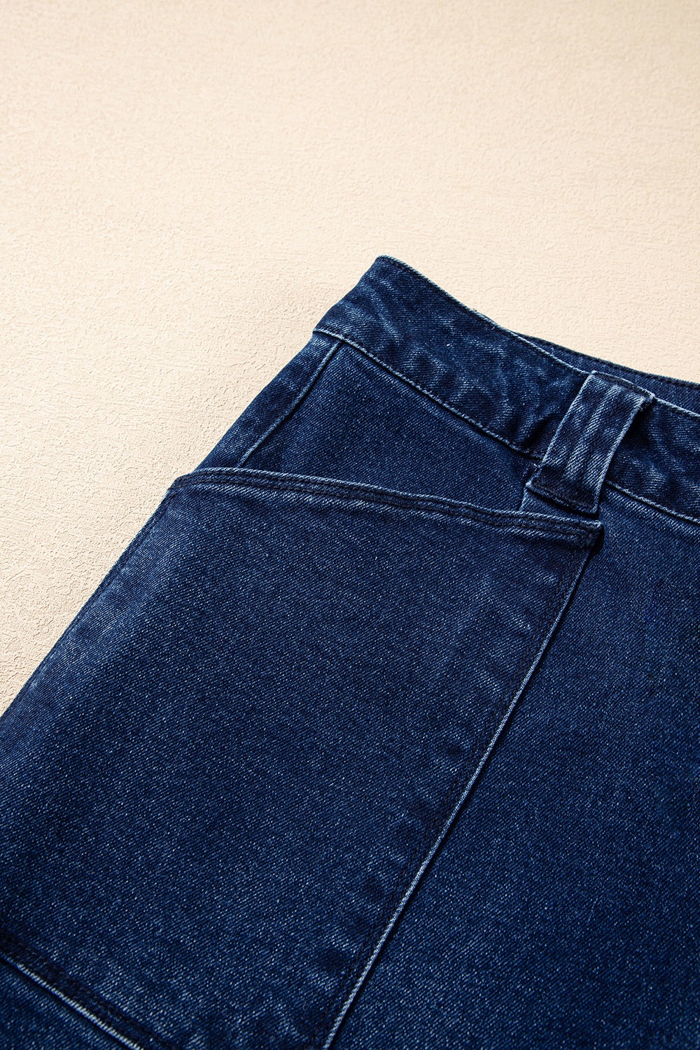 Straight leg navy jeans angled view