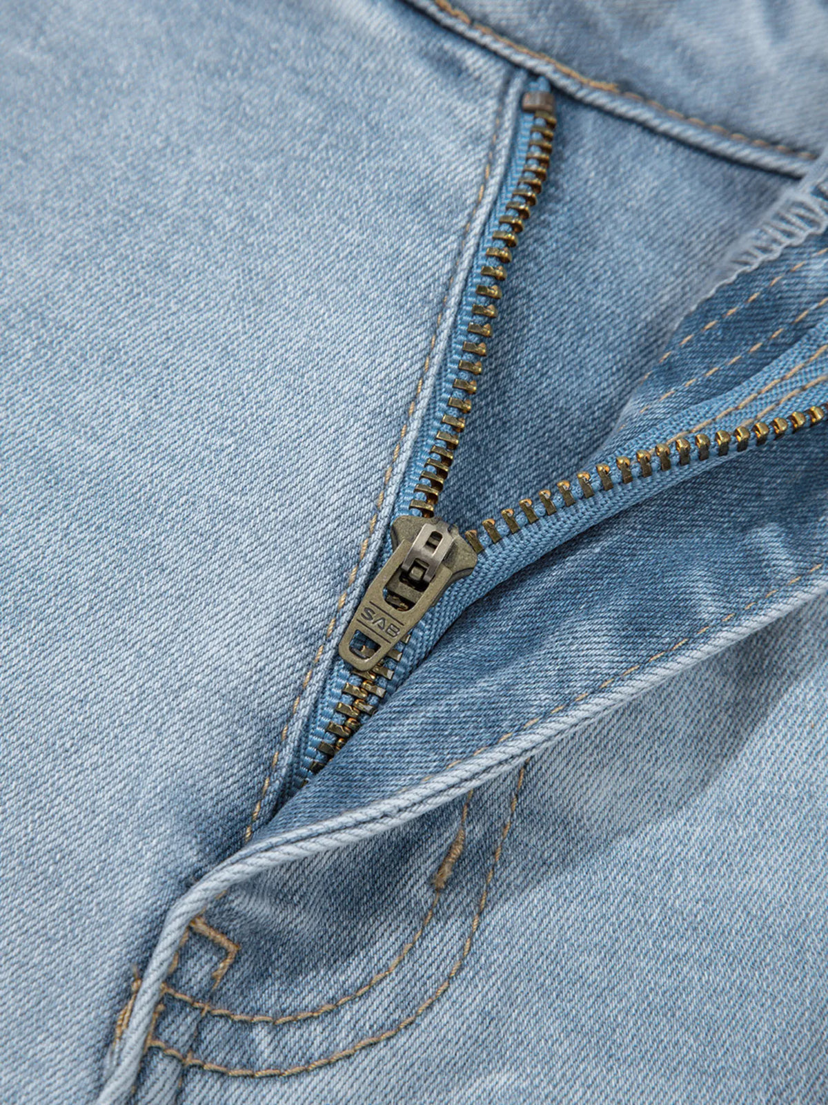 Model wearing light blue distressed skinny jeans