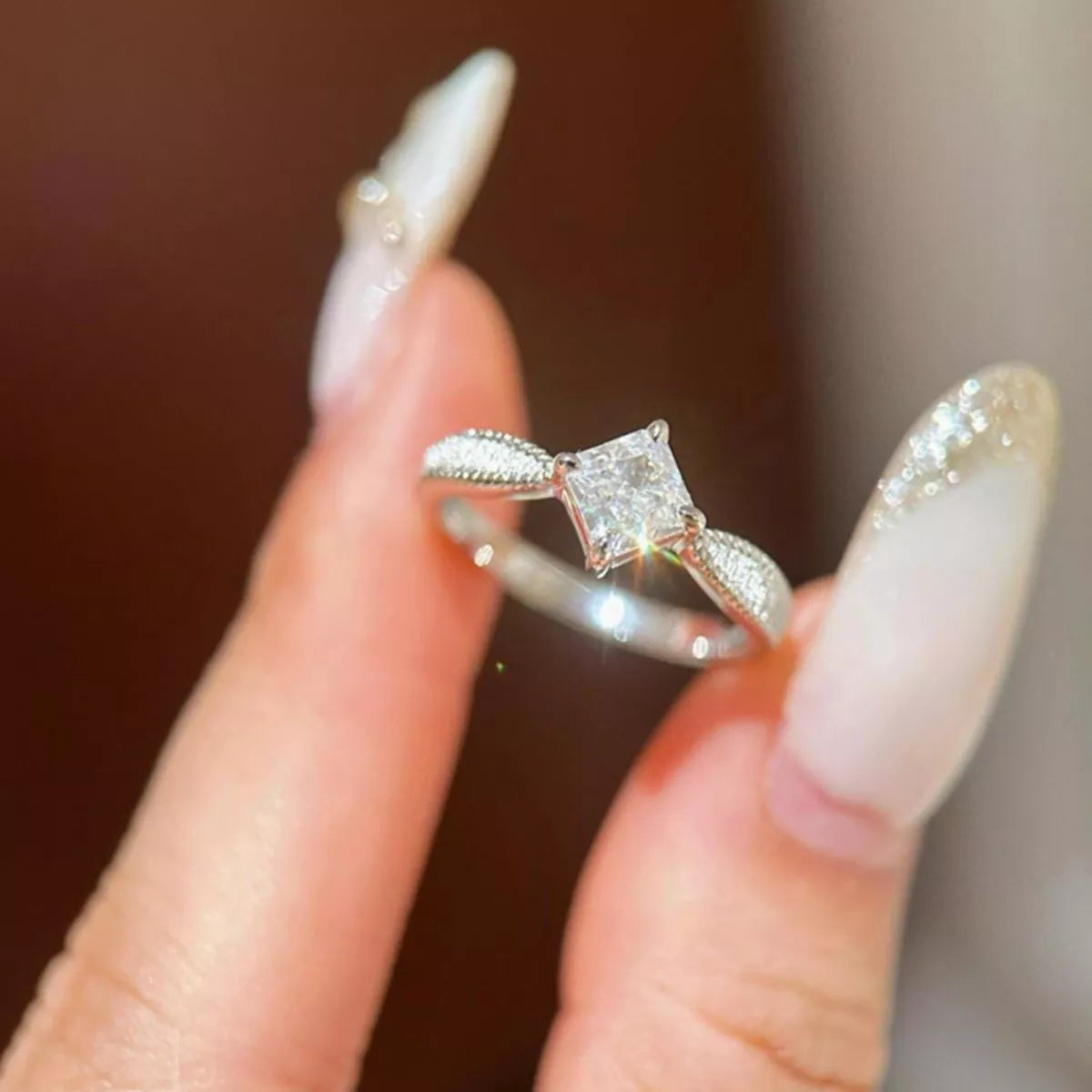 Angled view of the geometric silver band