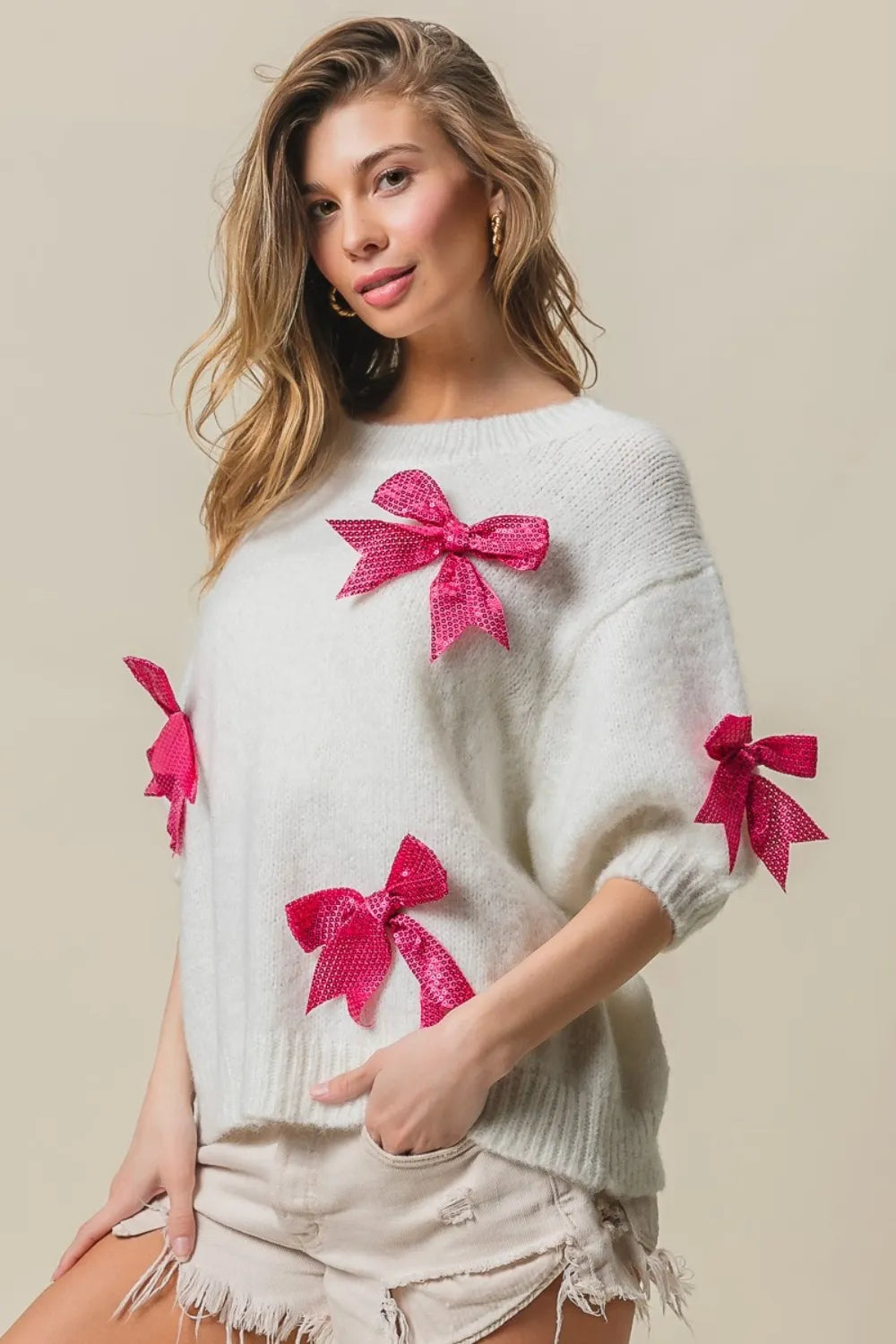 Sequin bow puff sleeve sweater front view