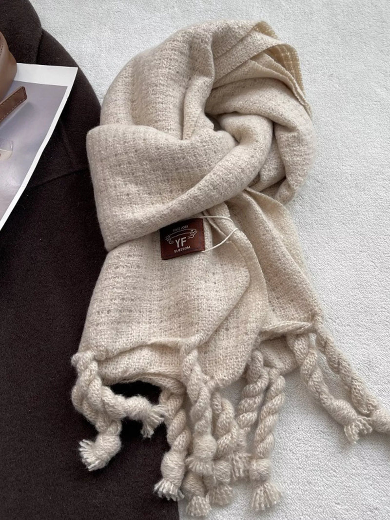 Knitted tassel scarf wrapped around the neck