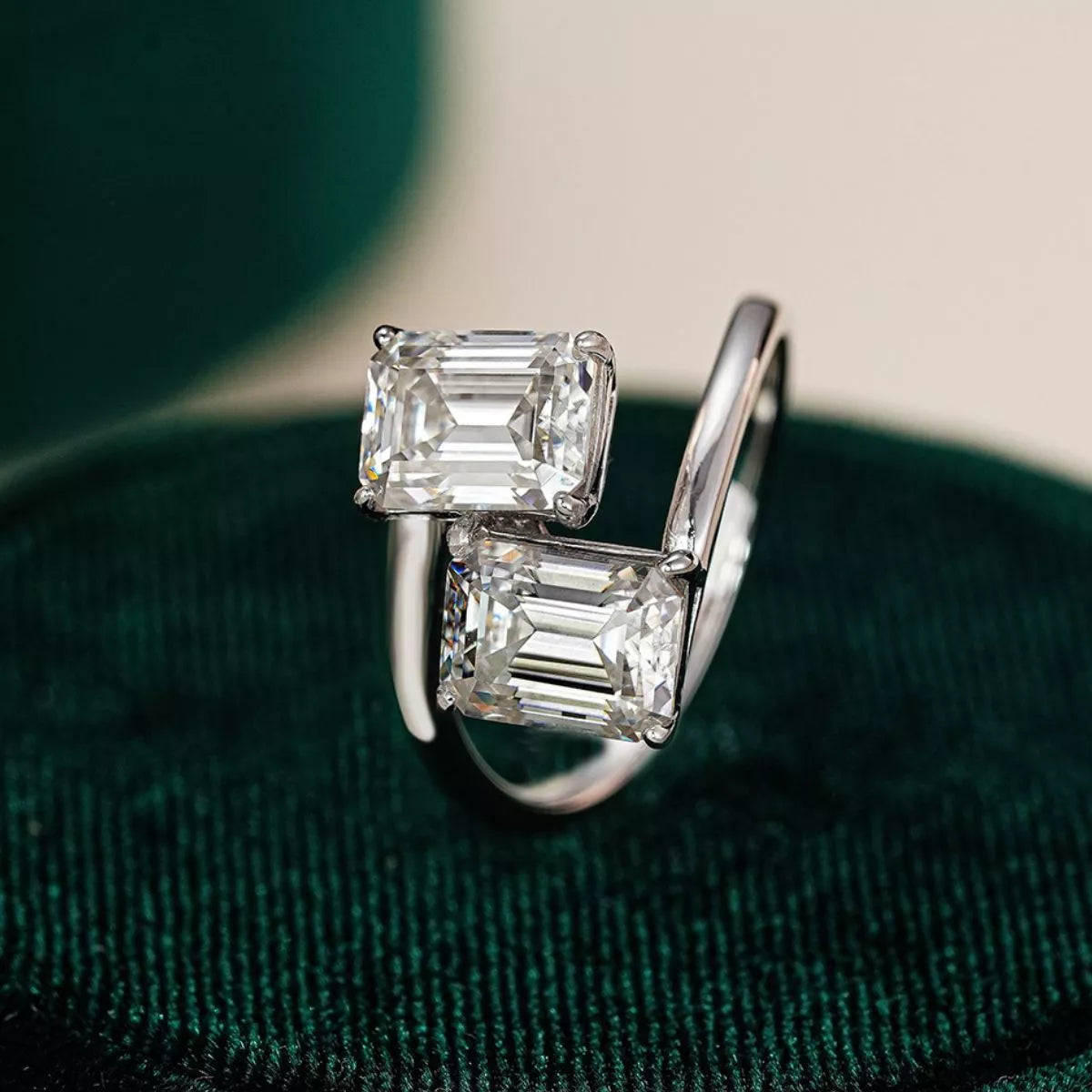 Moissanite bypass ring in sterling silver worn on a hand