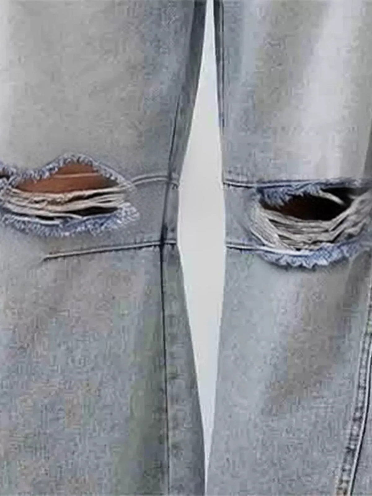 Ripped distressing on wide leg jeans