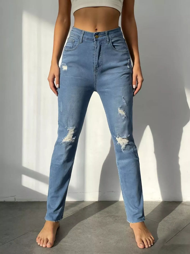 High waist distressed blue jeans front view