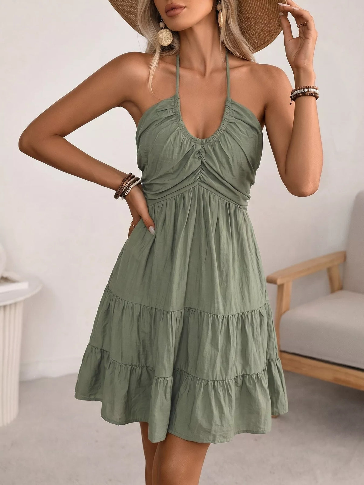 Green halter neck tiered mini dress, side view