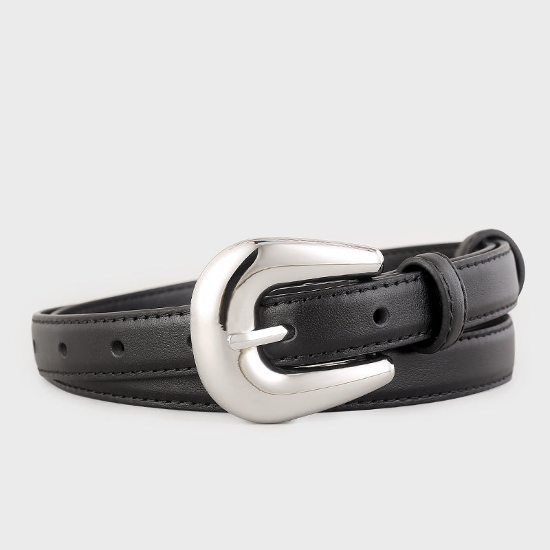 Leather belt with silver buckle coiled flat
