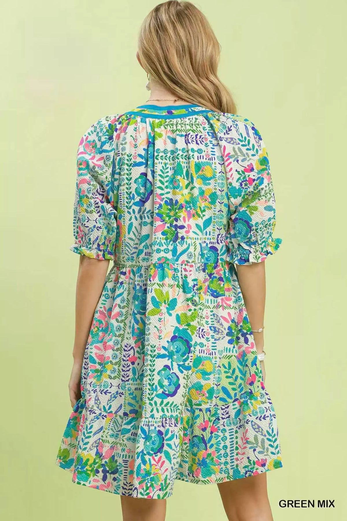 Green botanical print tiered dress side view