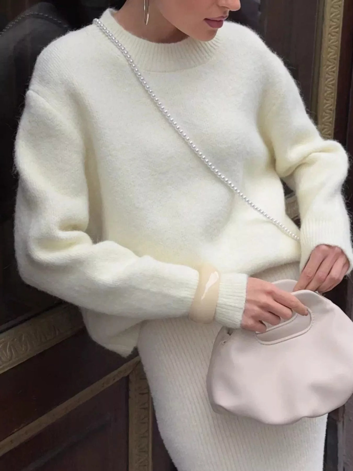 round neck dropped shoulder sweater sleeve and cuff detail