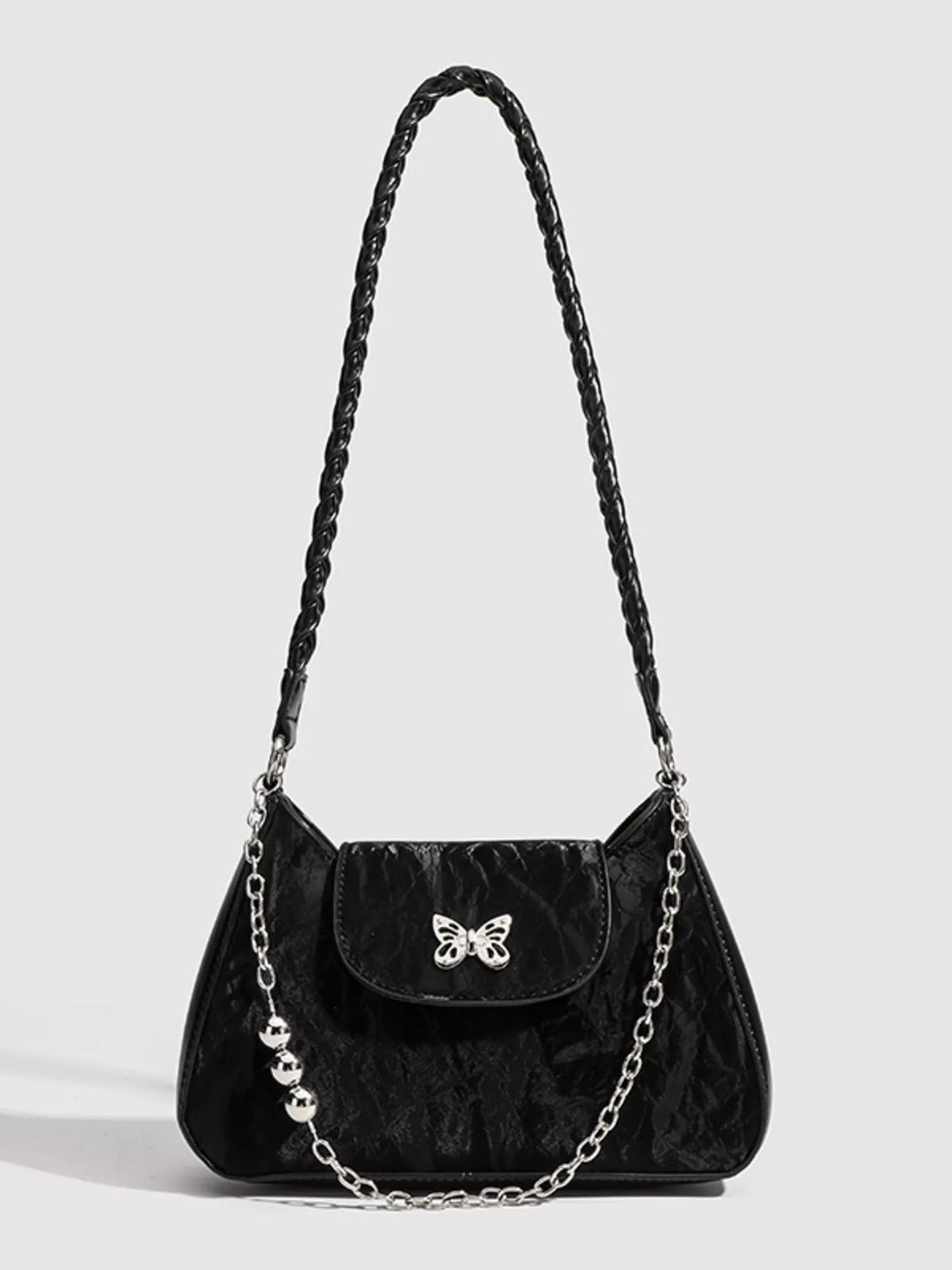 Butterfly detail close up on mini shoulder bag