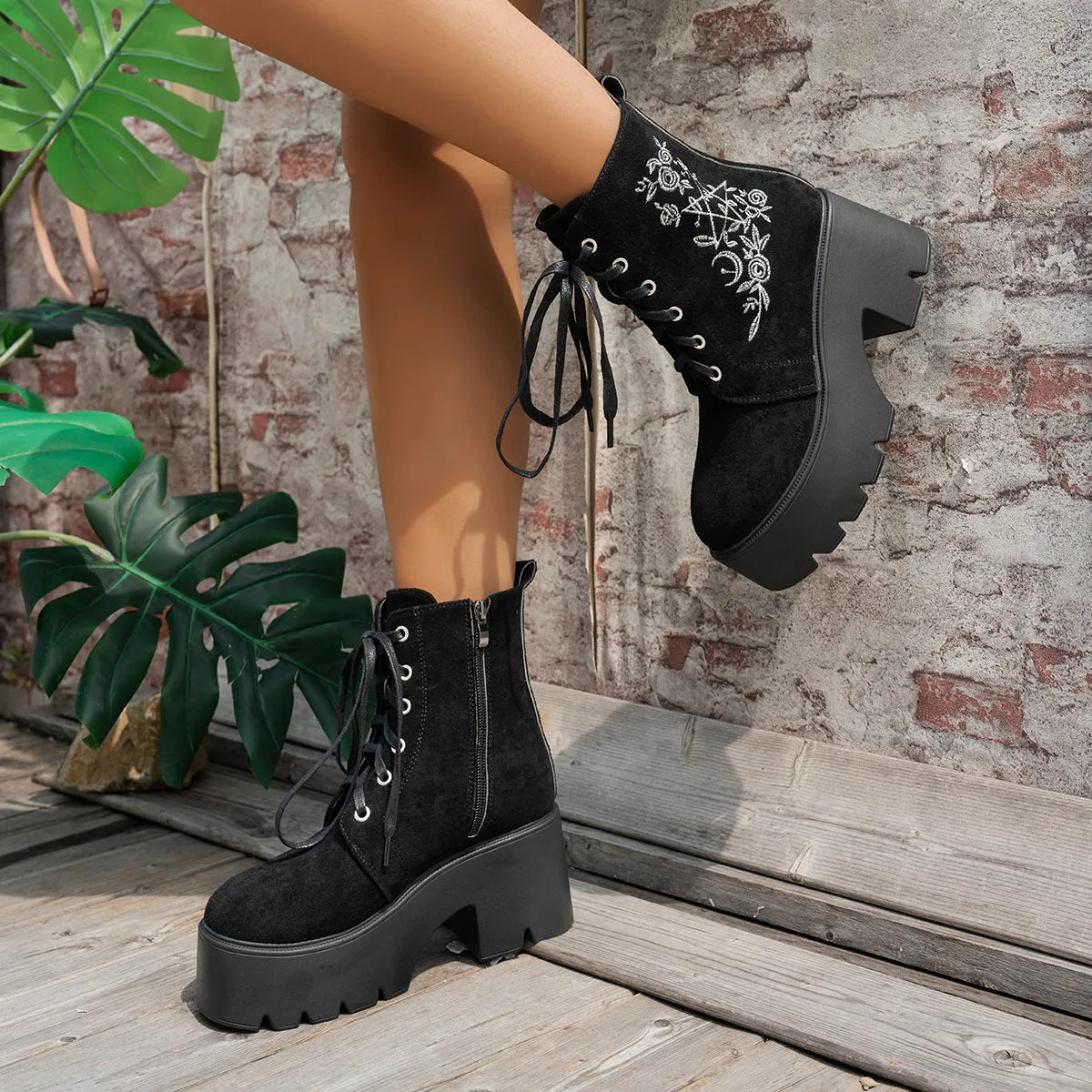Floral embroidered platform combat boots, angled three quarter view