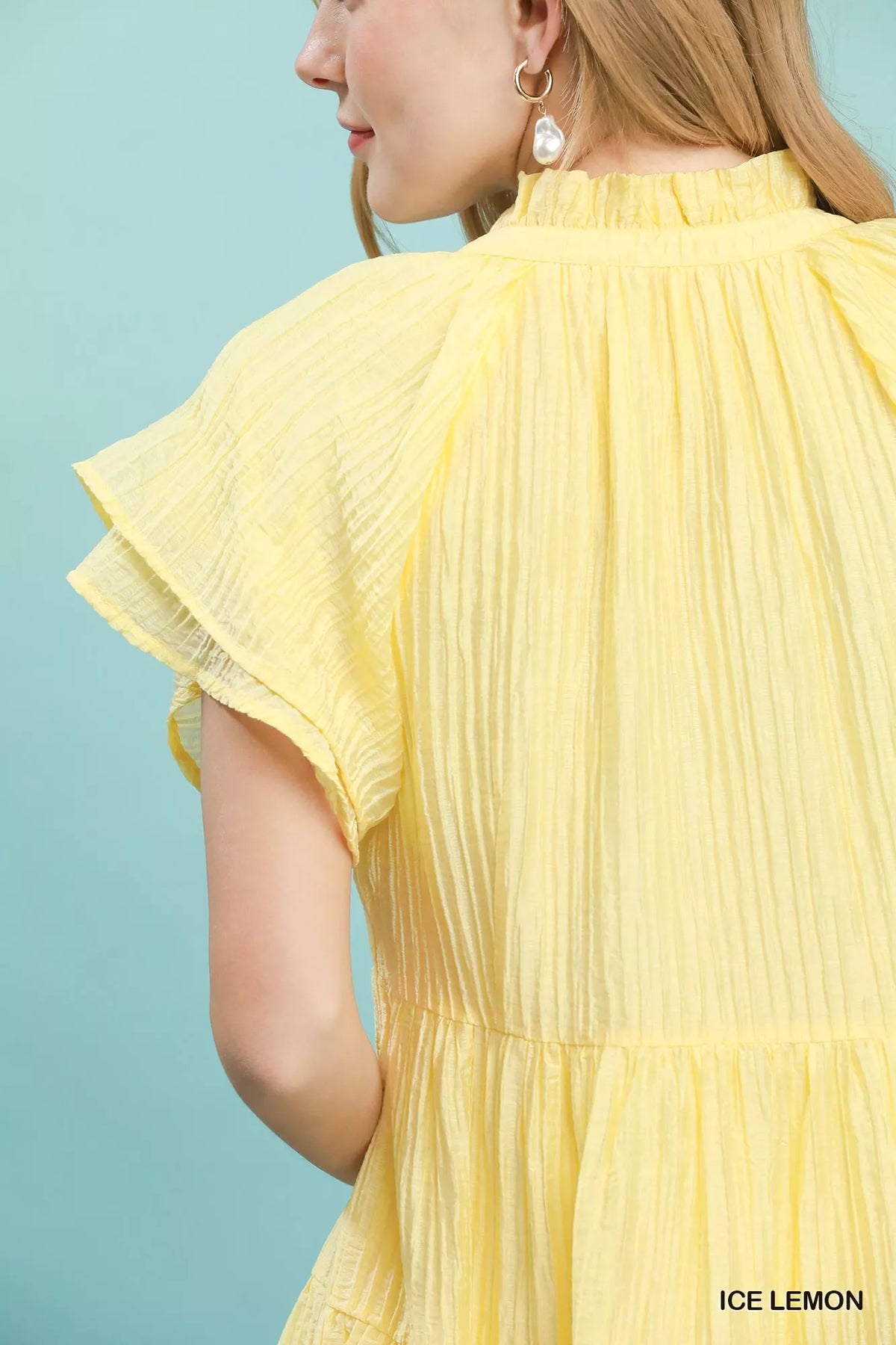 Ice lemon textured mini dress fabric detail view