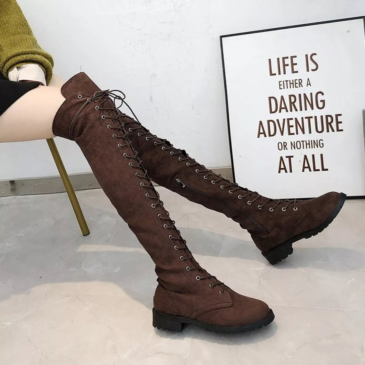 Lace up over the knee boots worn on model