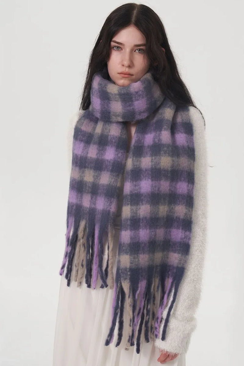 Fringe plaid polyester scarf shown draped around the neck