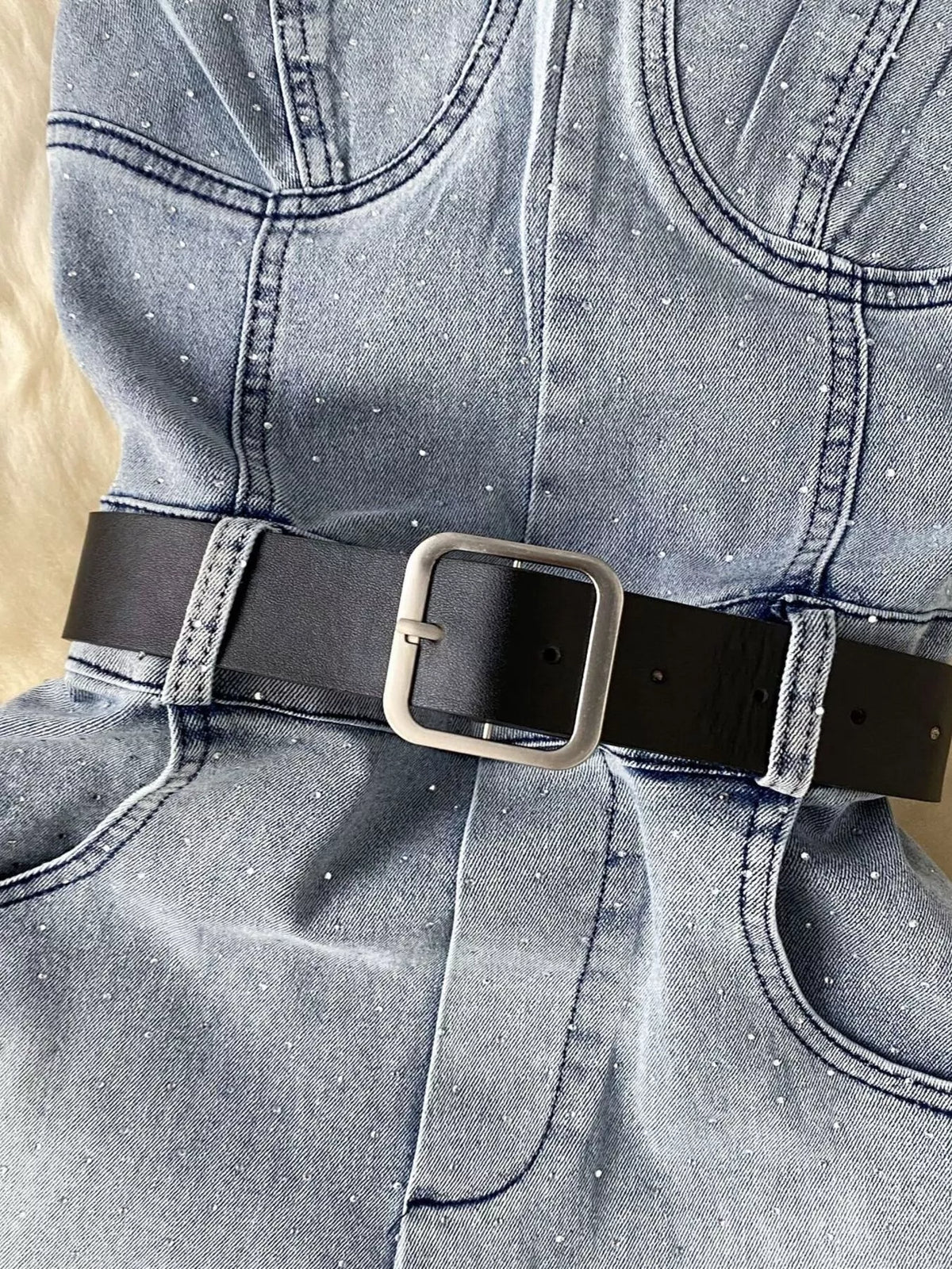 Blue strapless denim romper with diamante detail back view