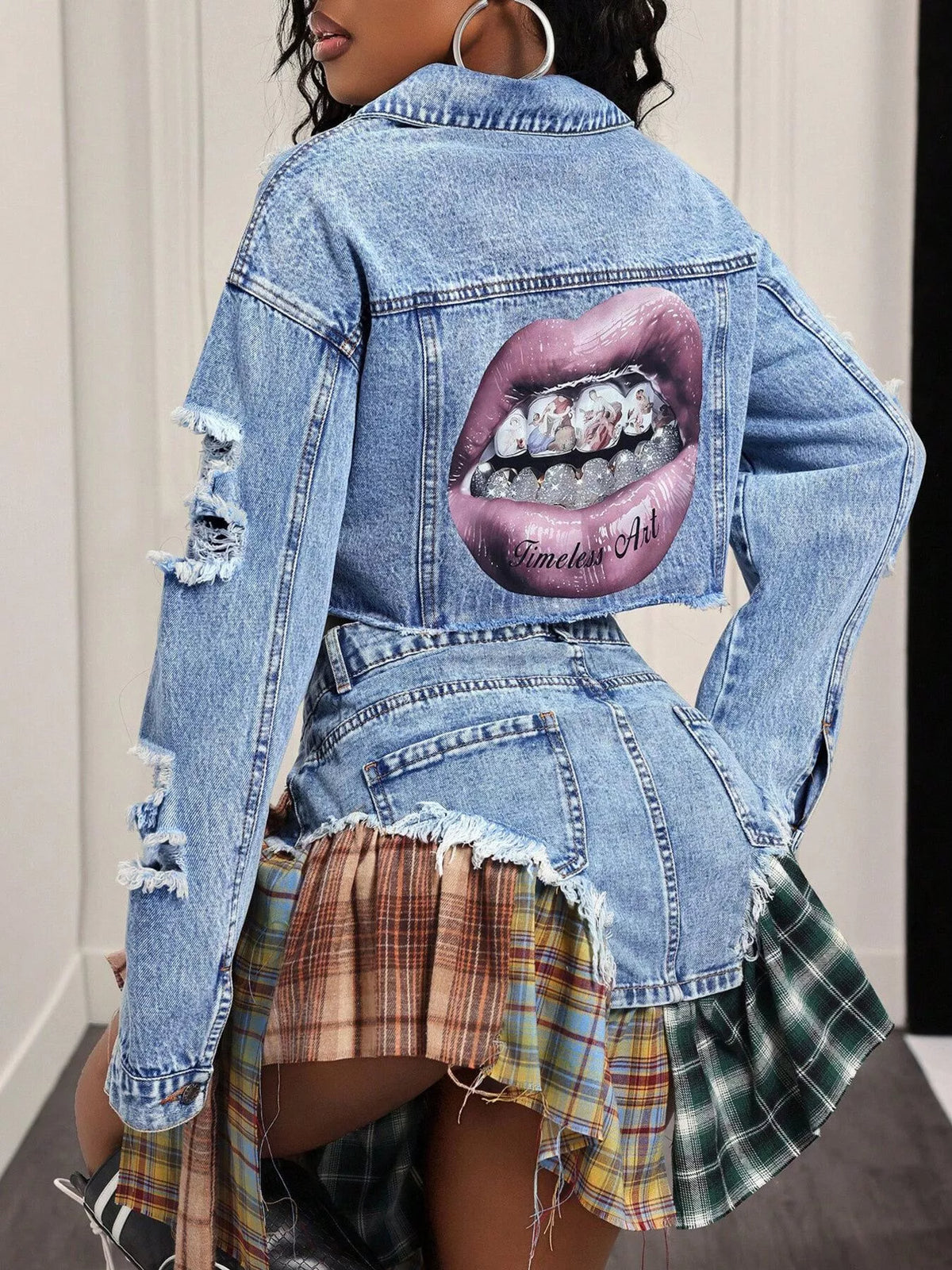 Blue cropped denim jacket back view