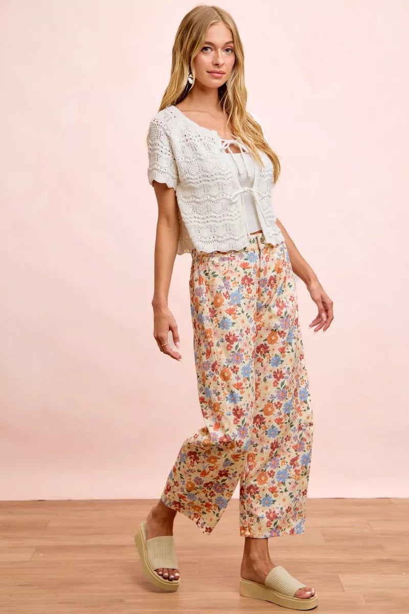 Three quarter view of the cream multi printed twill pants
