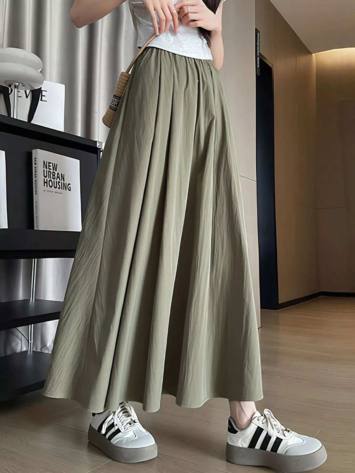 Model wearing the sage maxi skirt