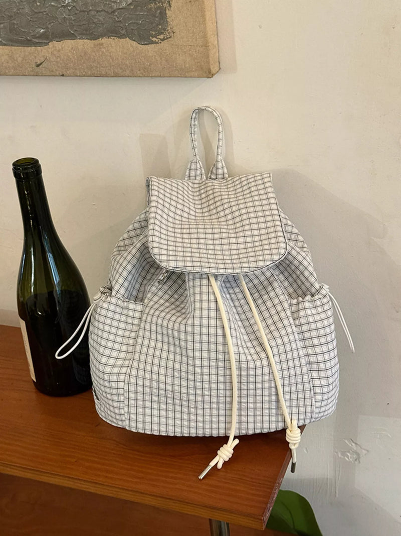 White plaid drawstring canvas backpack front view