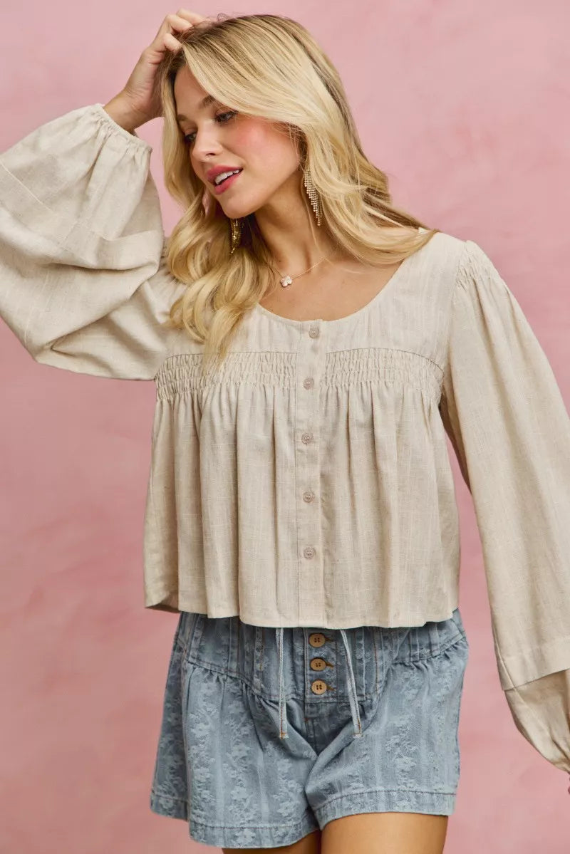Cream linen blend smocked long sleeve top, back view