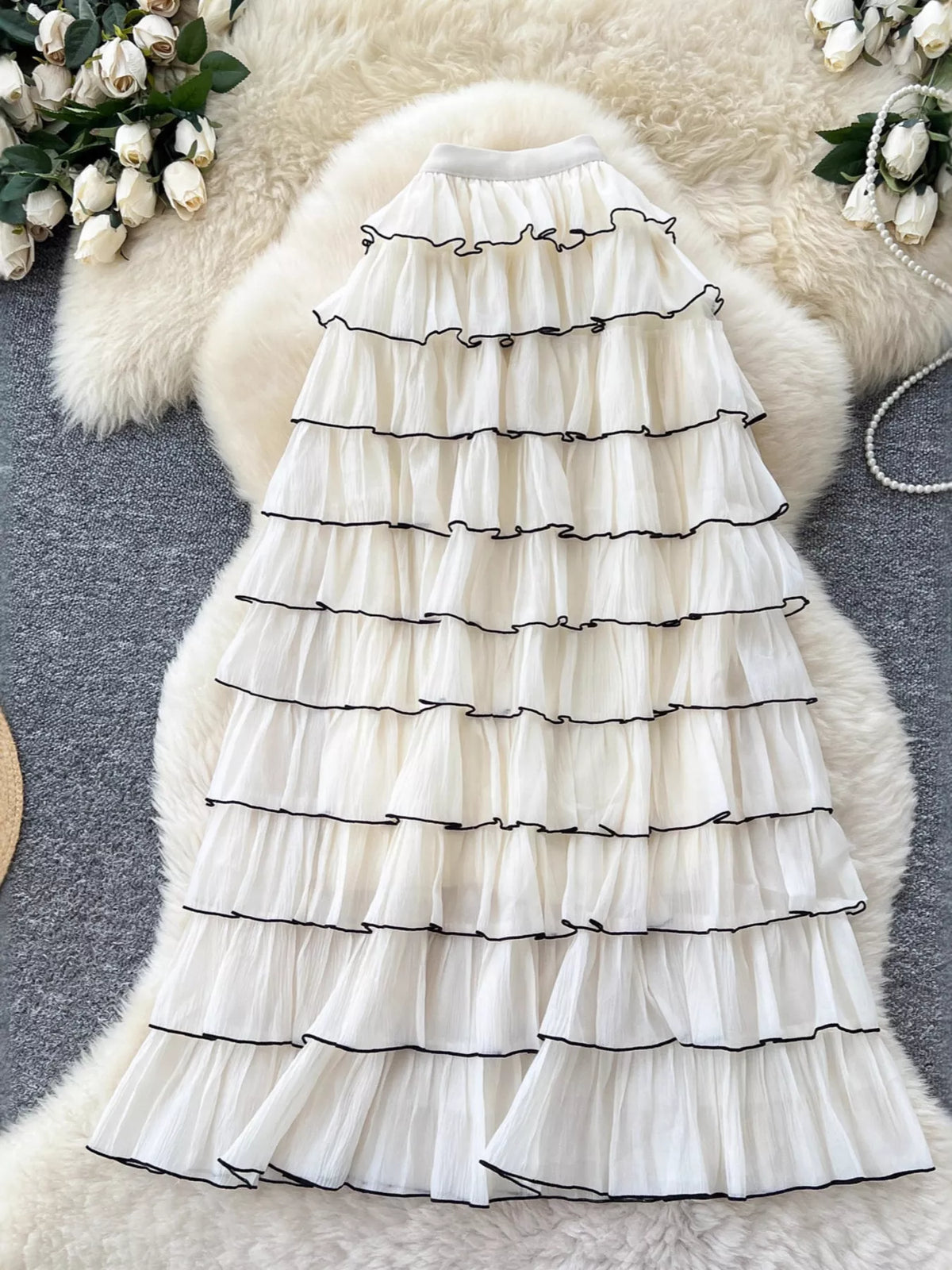 Apricot ruffled tiered skirt, side view showing flowy drape
