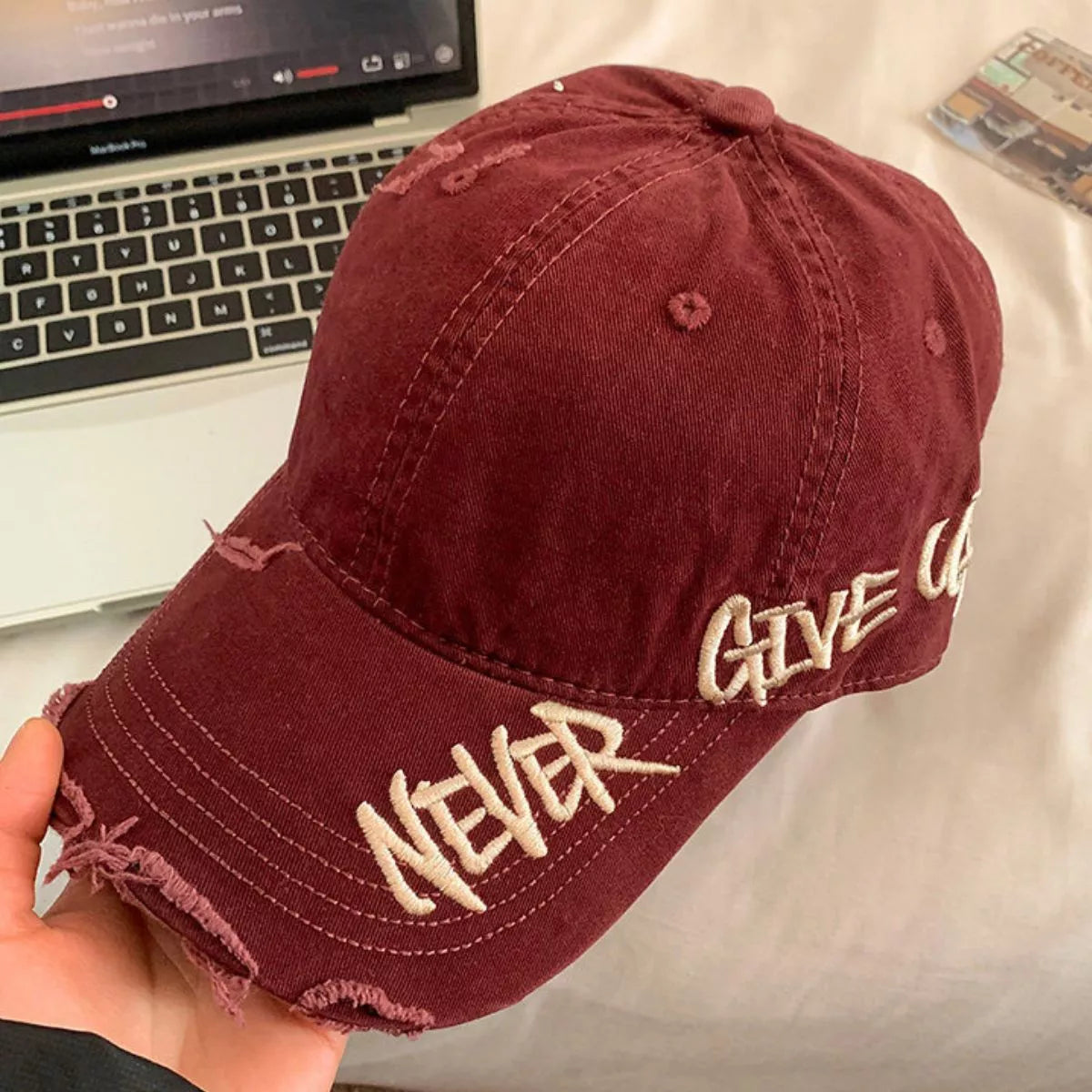 Side profile of the distressed letter baseball cap