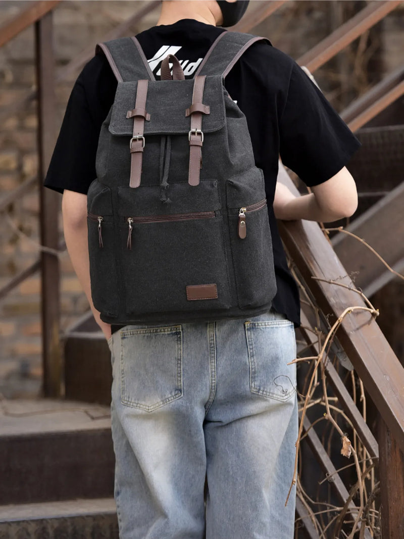 Black canvas buckle backpack front view