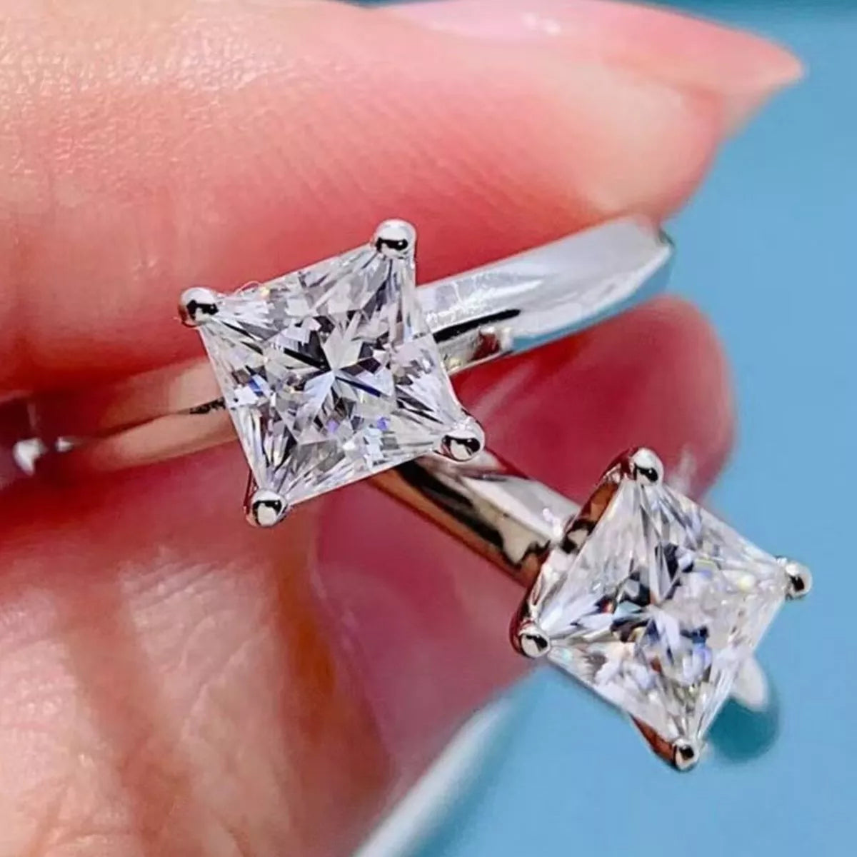 Moissanite solitaire ring worn on hand