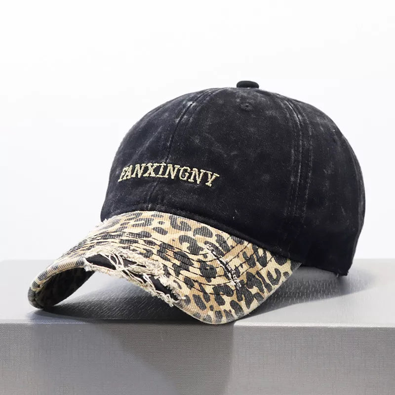 Close view of the frayed distressed edge on the leopard print peak