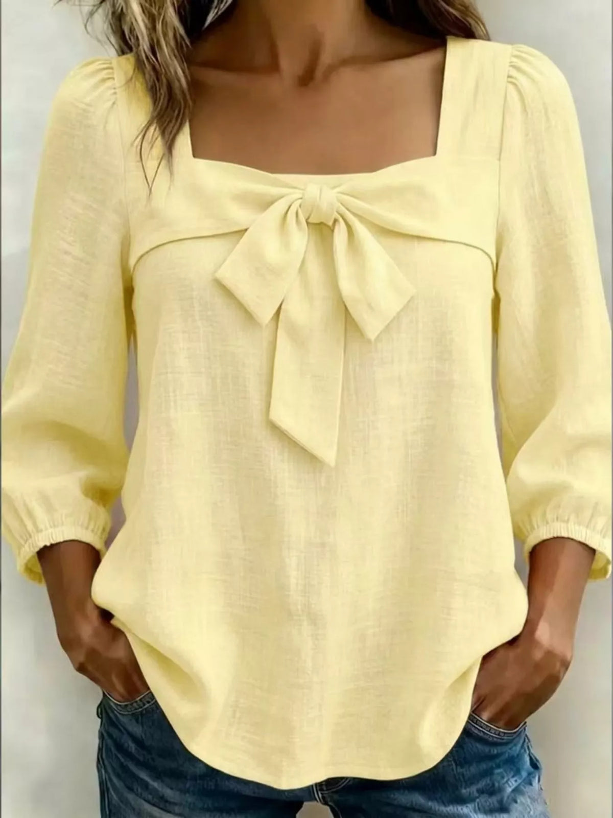 Light yellow bow front blouse front view