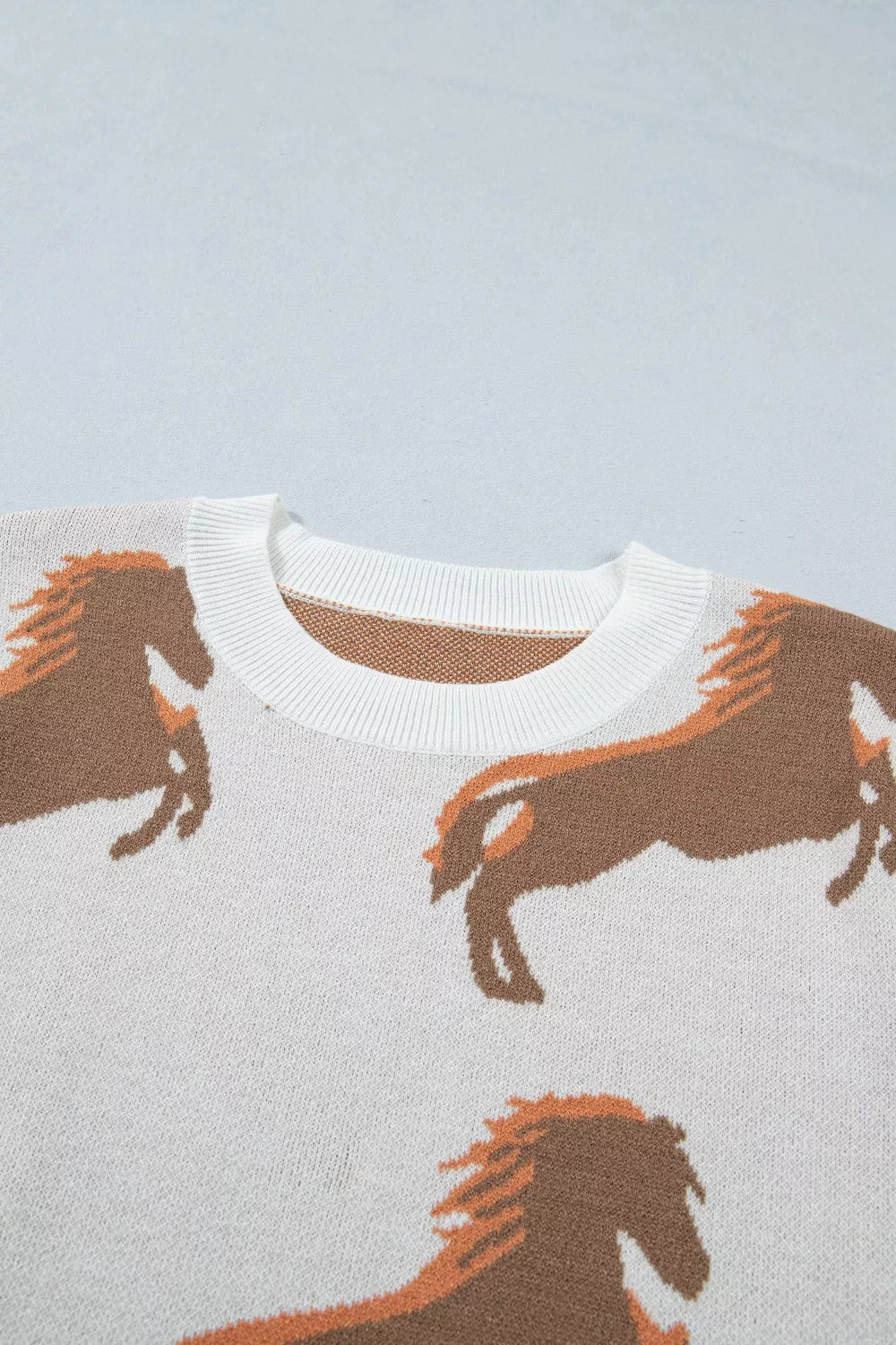 Cozy beige knit western sweater close up