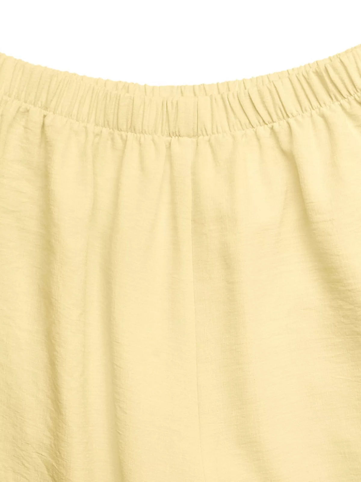 Yellow top and pants styled with sandals