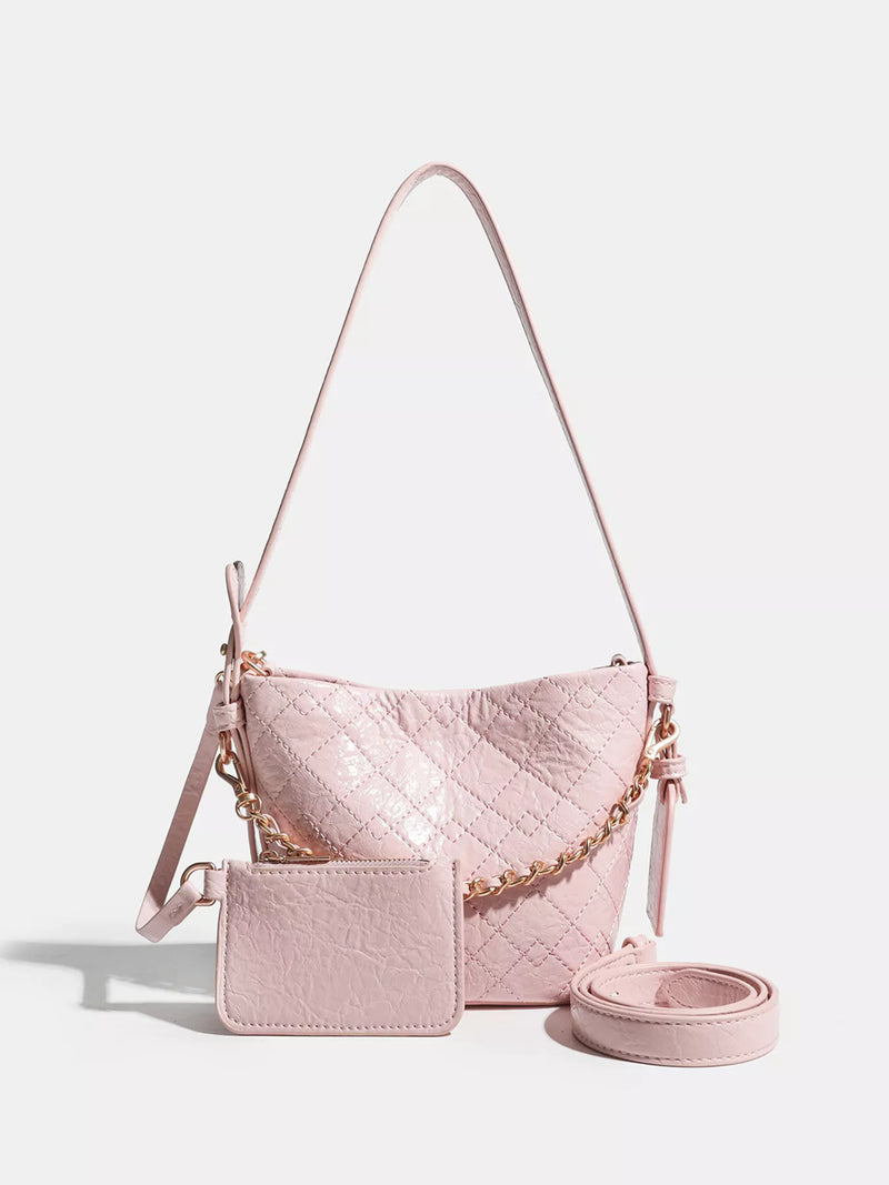 Adjustable strap mini bucket bag front view