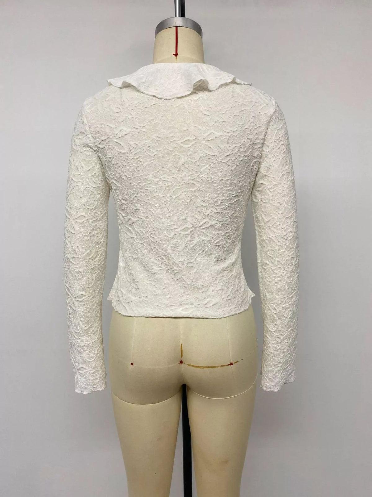 Hem detail on fitted apricot long sleeve tee