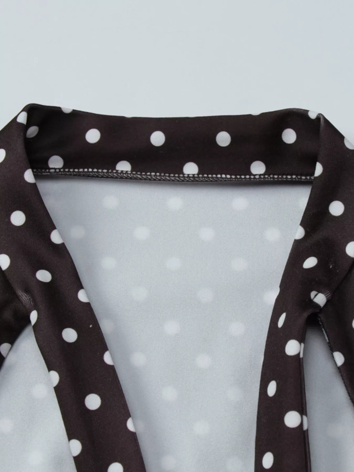Brown polka dot dress showing front cutout