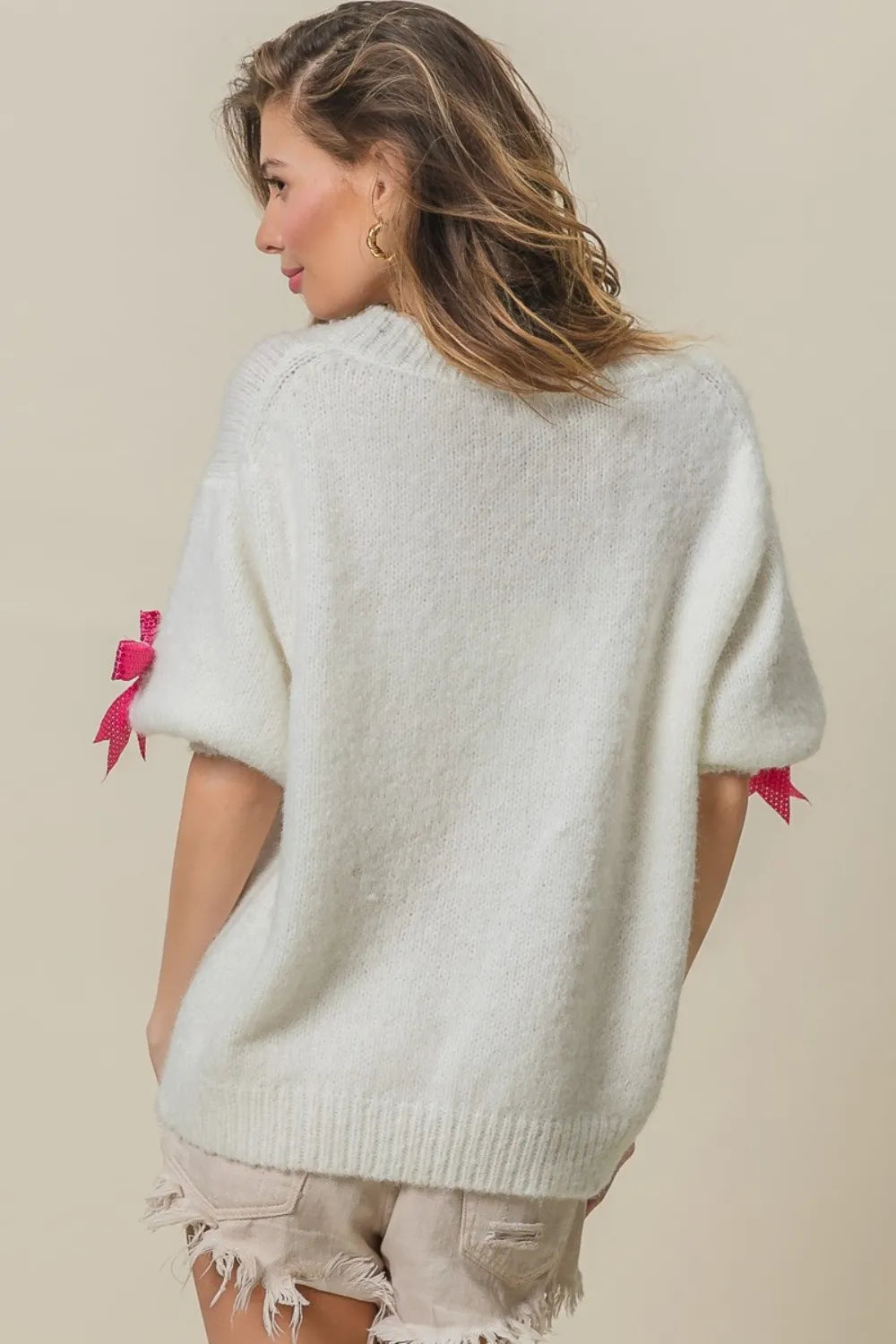 Sparkly sequin puff sleeve sweater on model