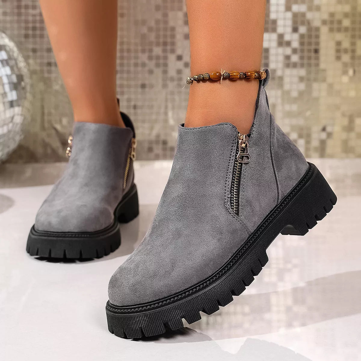 Round toe side zip ankle boots angled studio view