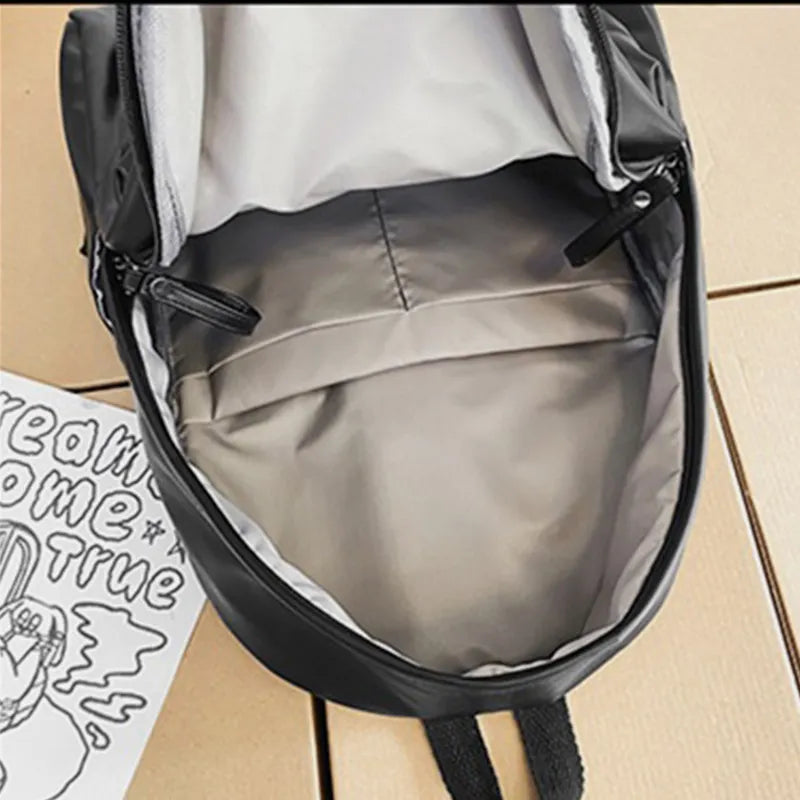 Faux leather zip backpack worn on the shoulders