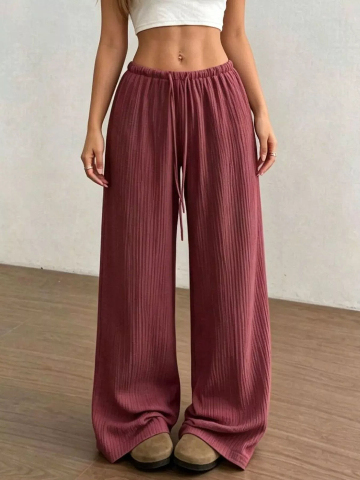 Cotton fabric texture detail on the pants