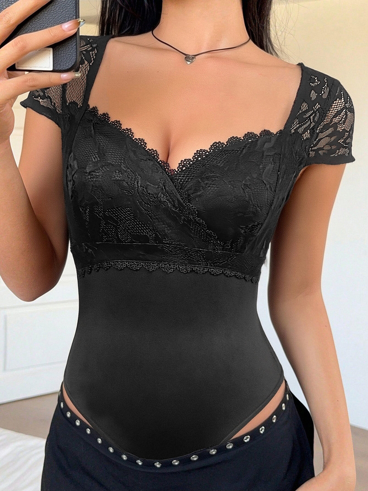 Sweetheart neckline detail of the lace bodysuit