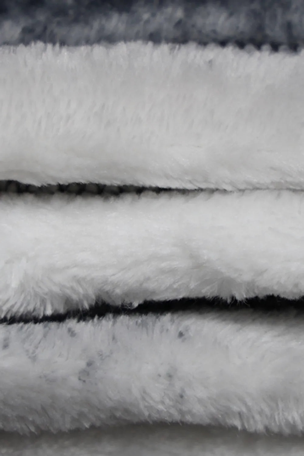 Marble print throw blanket draped over a sofa