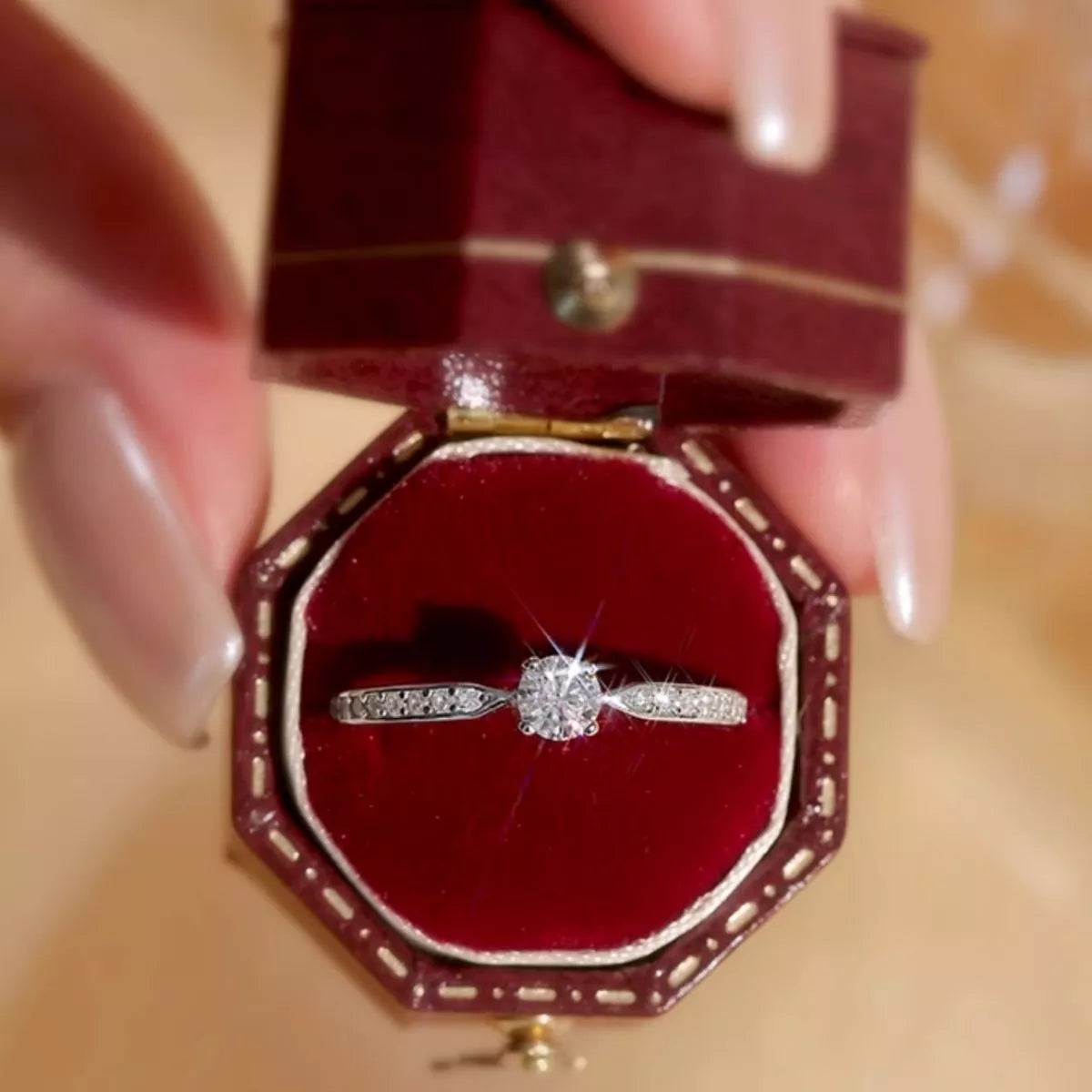 Adjustable moissanite ring worn on the hand