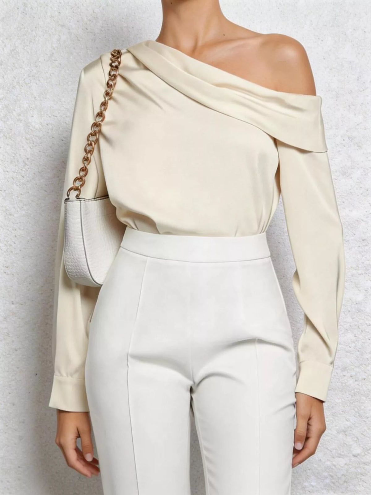 Cream one shoulder long sleeve blouse, side view