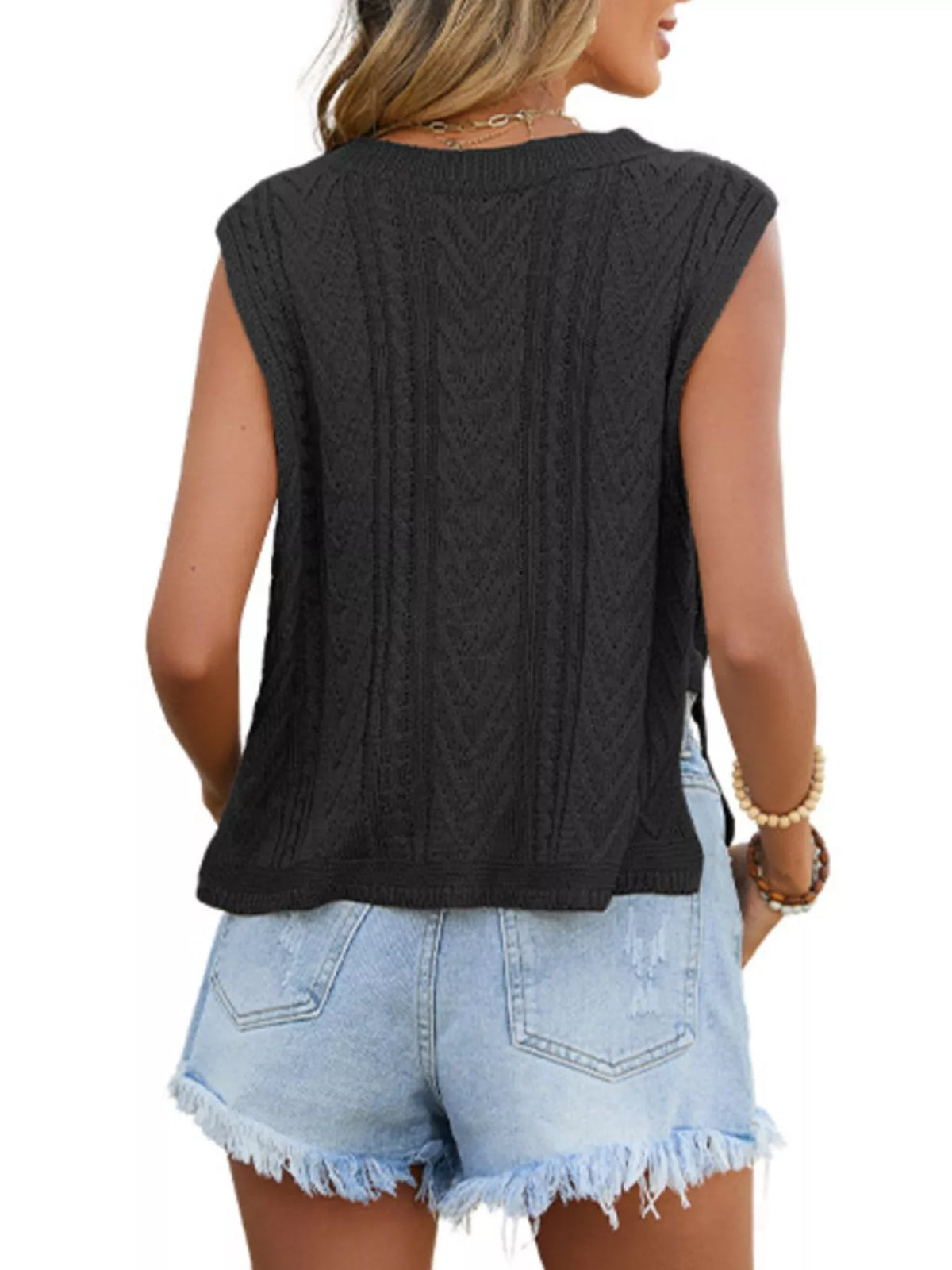 Cable knit round neck sweater vest detail view