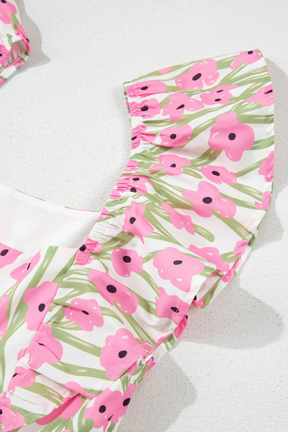 Blush pink floral square neck cap sleeve maxi dress, seated styled view
