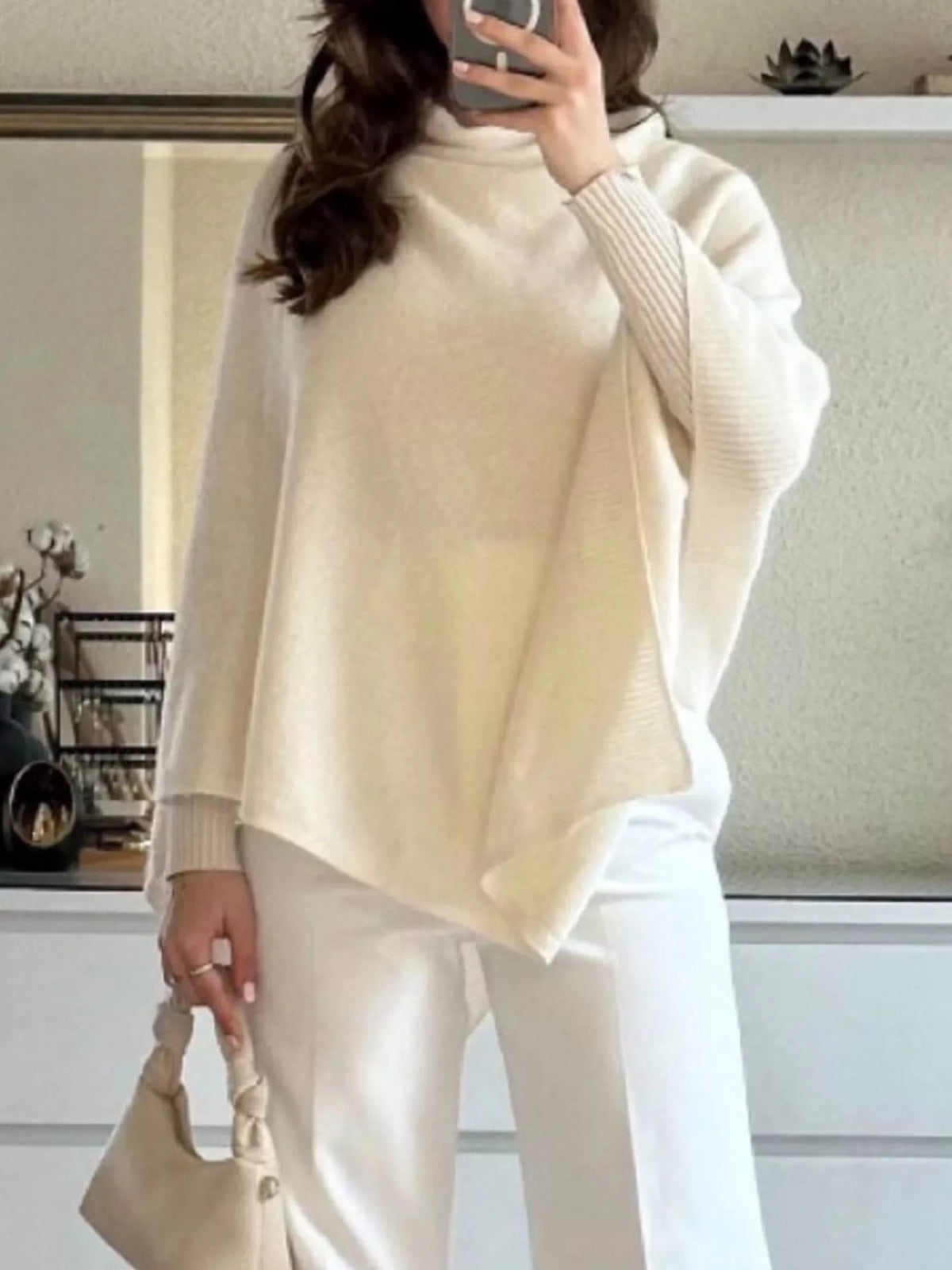 Turtleneck loose knit sweater poncho knit texture close up