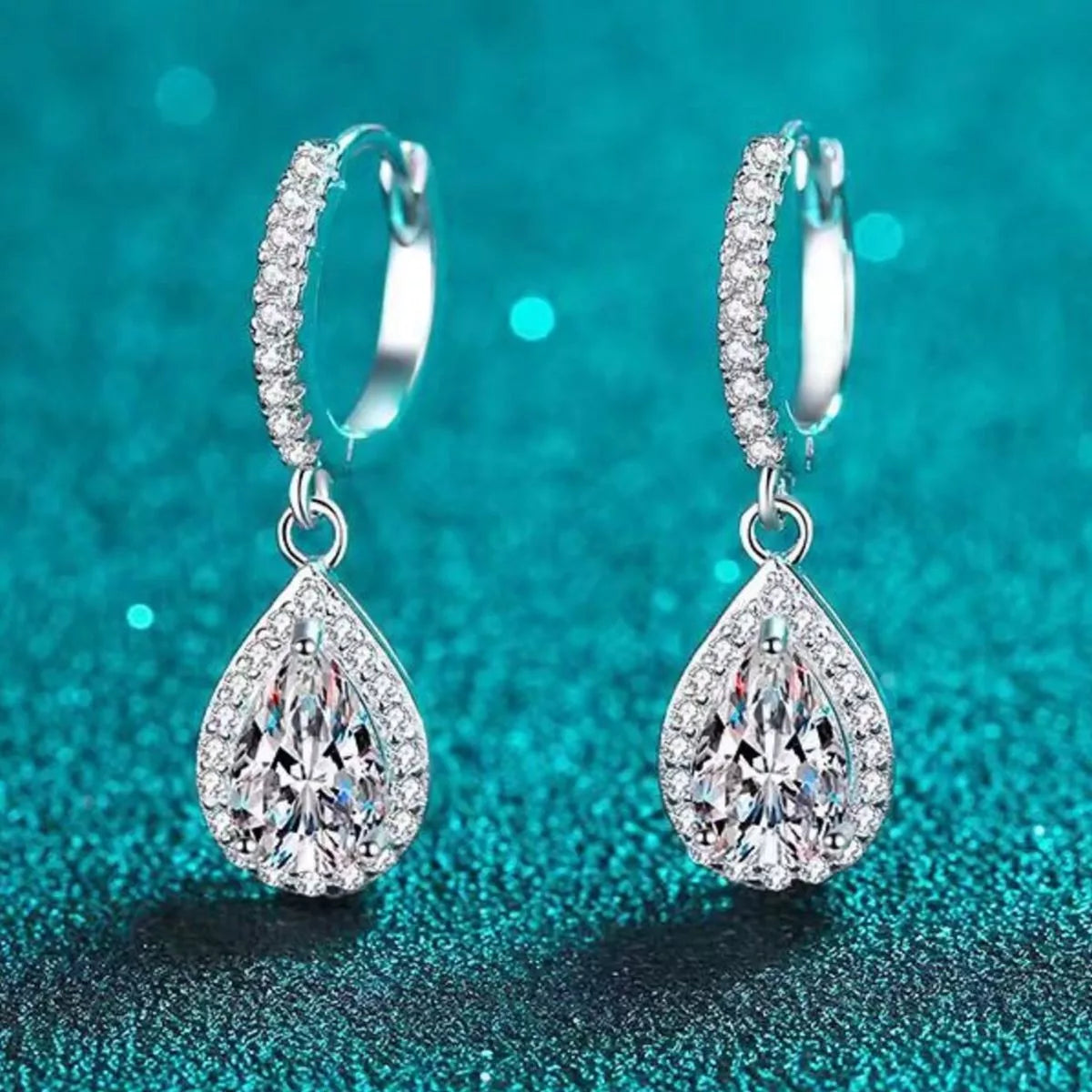 Teardrop earrings shown worn on the ear