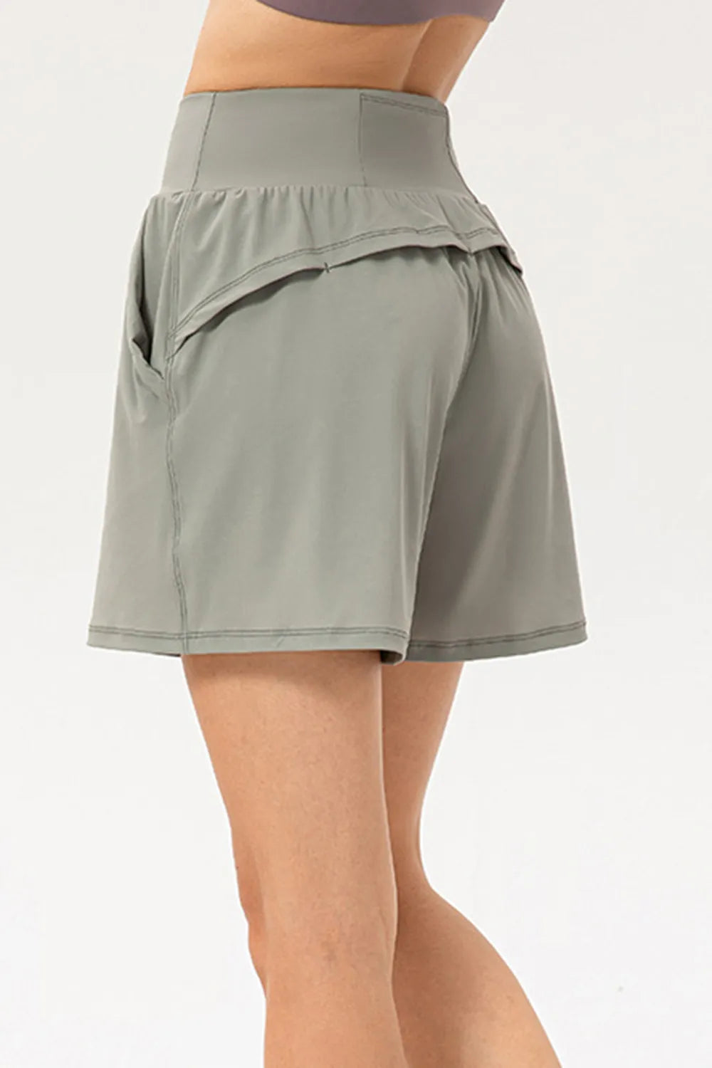 Elastic waist workout shorts side view on model
