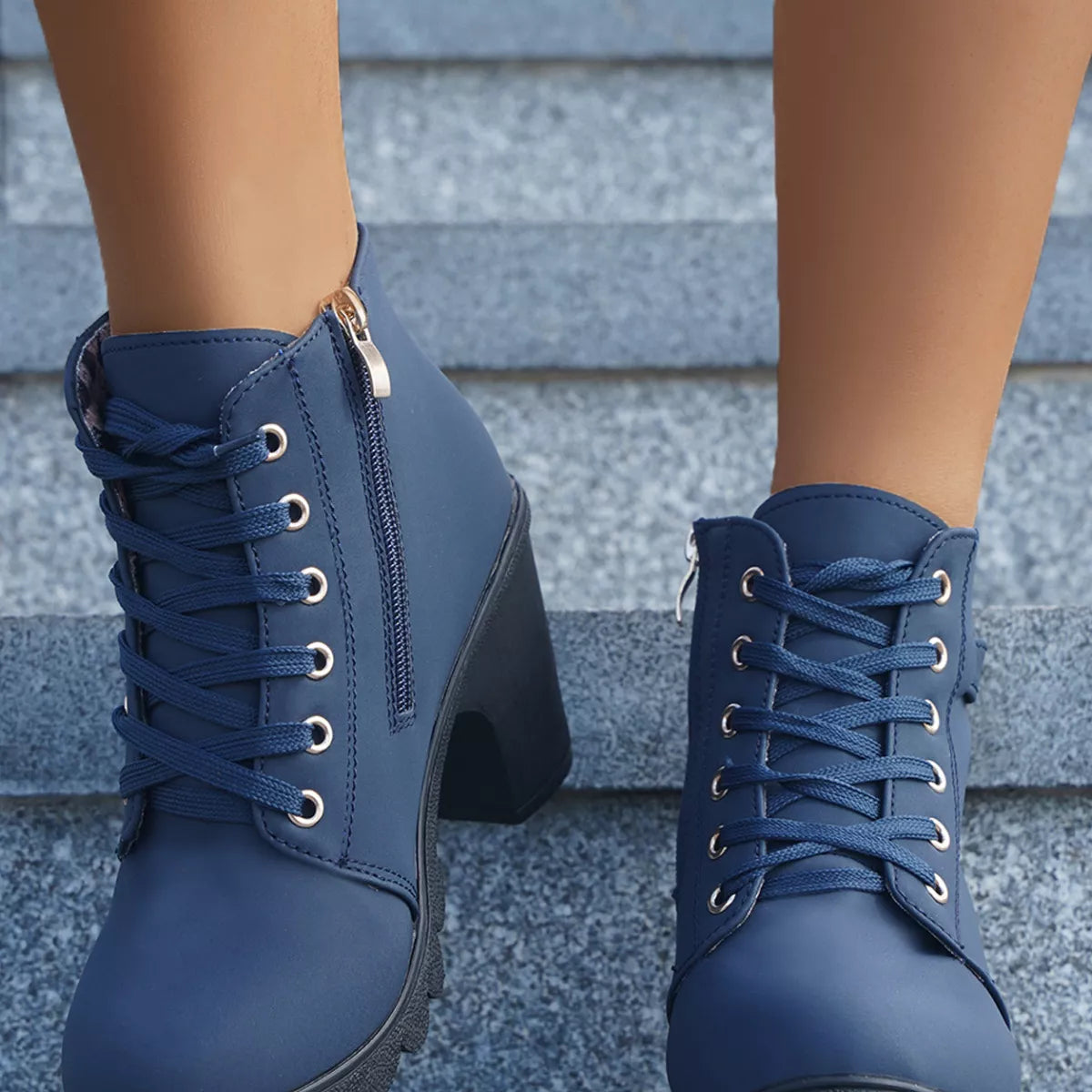 Lace up block heel suede boots worn with cropped jeans