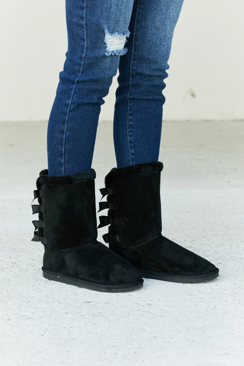 bow detail faux suede snow boots front view