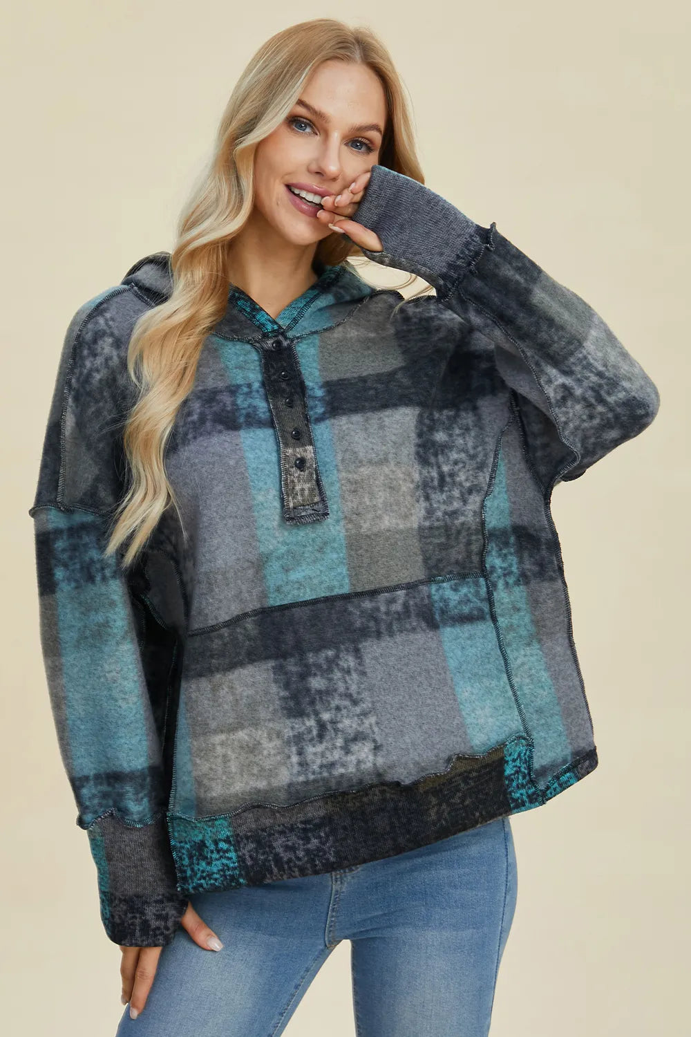 Detail of hood and drawcord on plaid hoodie